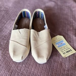 Toms, size 7. Light yellow color! Basically new, still has tags.